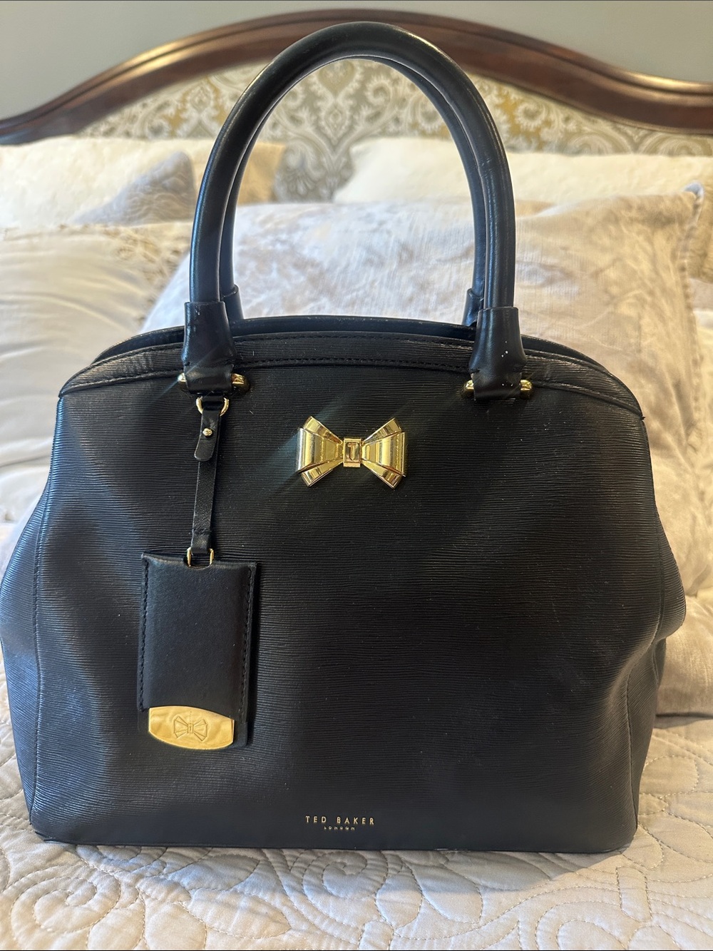 Ted Baker Black Leather Satchel with Gold Bow Accent
